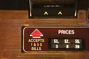 Close-up of money slot on jukebox.