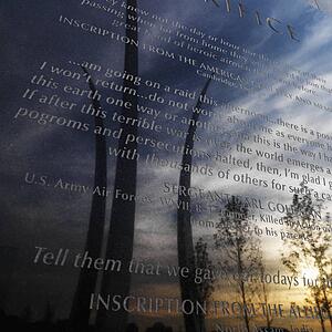 Three spires of Air Force Memorial reflected in marble engraved plaque in Arlington Virginia