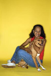 African American prime adult female with dog.