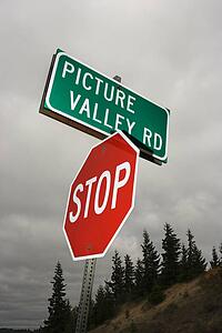Stop sign and sign reading Picture Valley Rd.
