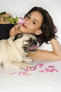 Caucasian prime adult female with Pug dog.