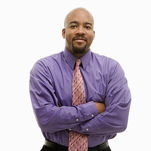 African-American businessman portrait with arms crossed looking at viewer.
