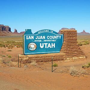 Welcome sign in desert for San Juan 