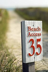 Beach access walkway and sign on Bald Head Island, North Carolina.