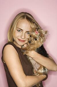 Caucasian young adult female with Yorkshire Terrier dog.