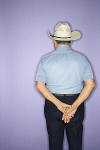 Caucasian mature adult male wearing cowboy hat.