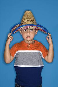 Male Hispanic boy wearing sombrero.
