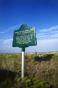 Historical marker on beach on Bald Head Island, North Carolina.