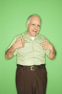 Caucasian mature adult male pointing to himself.