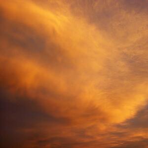 Orange clouds in sky with sunset.