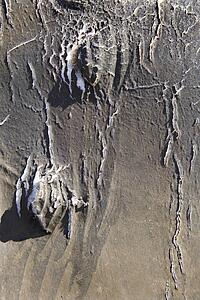 Detail of old and disintegrating vinyl covering from old automobile.