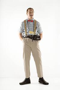 Caucasian young man dressed like nerd smiling with eyes closed.