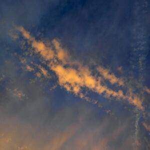 Golden clouds in sky with sunset.