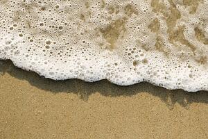 Close-up of sand and wave.