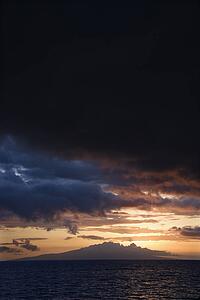 Sunset behind Kihea island and Pacific Ocean in Maui, Hawaii, USA.