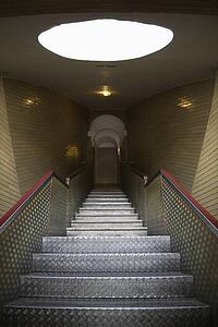 Interior stairs leading to door.