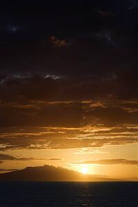 Sunset over Pacific Ocean and Kihea island in Maui, Hawaii, USA.