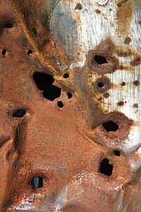 Old rusty metal with holes
