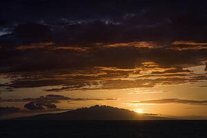 Sunset over Pacific Ocean and Kihea island in Maui, Hawaii, USA.