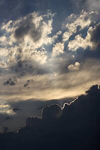 Sun peeking through clouds.