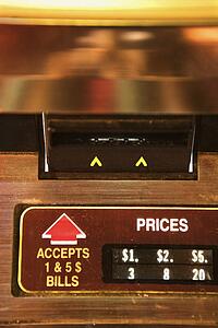 Close-up of money slot on jukebox.