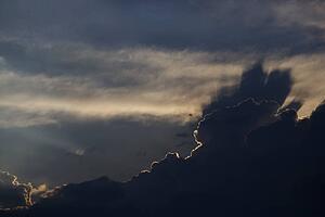 Sun peeking through clouds.
