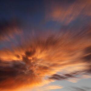 Orange clouds in sky with sunset.