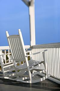 Rocking chairs on porch on Bald Head Island, North Carolina.