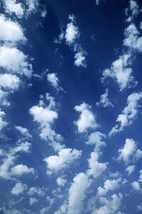 Cumulus clouds in blue sky.