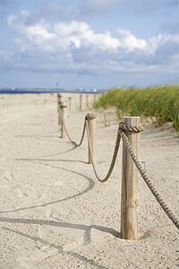 Rope fence barrier on beach.