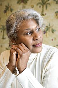 Portrait of mature African American woman looking to the side.