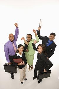 Portrait of multi-ethnic business group standing holding briefcases and cheering.