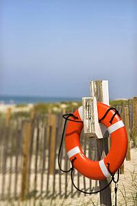 Life preserver hanging on post on Bald Head Island North Carolina