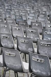 Close-up shot of several chairs in Saint Peter's Square in Vatican City, Italy.