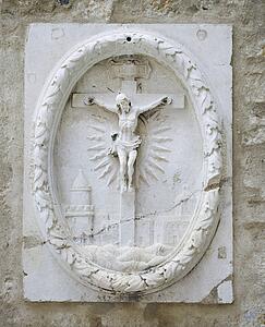 Relief sculpture of Crucifixion in Lisbon, Portugal.