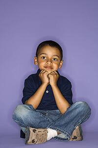 African American male child sitting portrait.