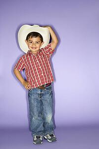 Hispanic male child wearing cowboy hat.
