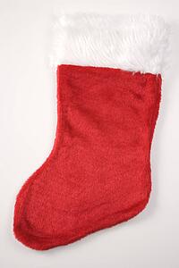 Still life of furry red Christmas stocking.