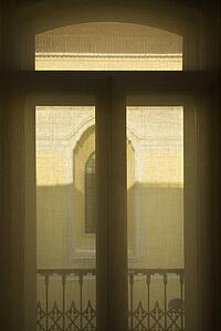 View looking out window from interior in Lisbon, Portugal.