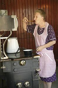 A woman sampling food 