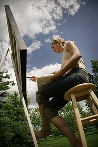 Artist painting on canvas