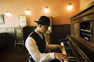 Man playing vintage piano
