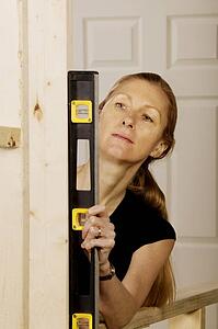Woman working with a level