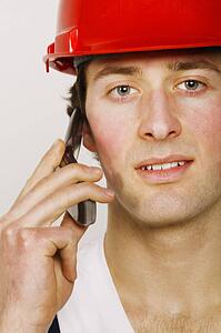 Portrait of a construction worker on the phone