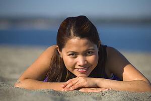 Woman laying on the beach