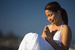 A young woman praying 