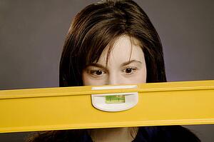 Woman holding a spirit level