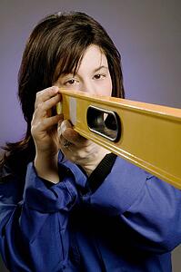 Woman holding a spirit level