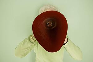 Woman shouting into a bullhorn