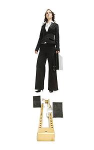 Businesswoman standing behind a starting block